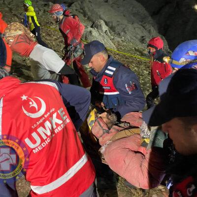 Rescuers carrying Mark to the medical tent. 